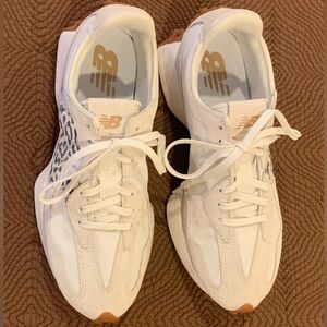 Worn one day. I’m not a sneaker gal but the NB 327s are so comfy & stylish!